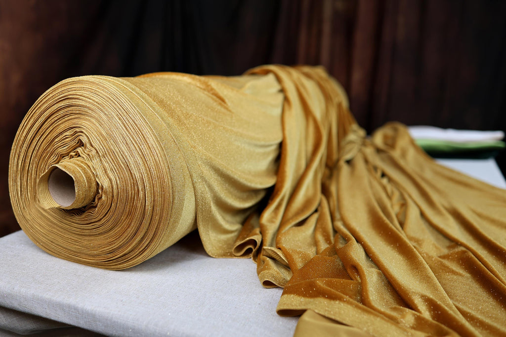 a roll of yellow fabric sitting on top of a table