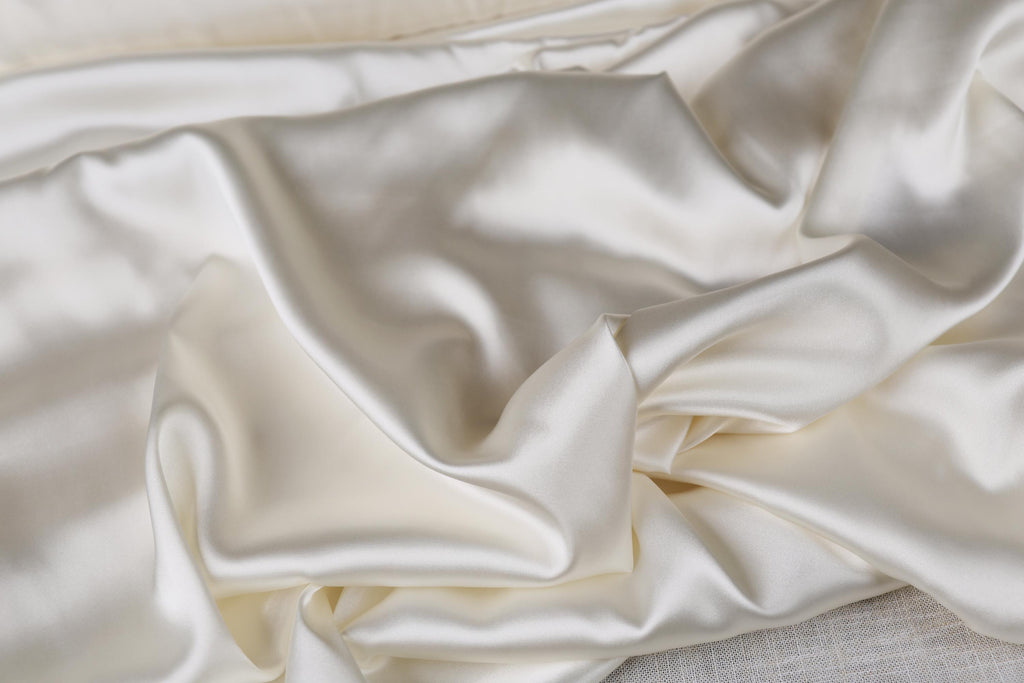 a close up of a white satin fabric