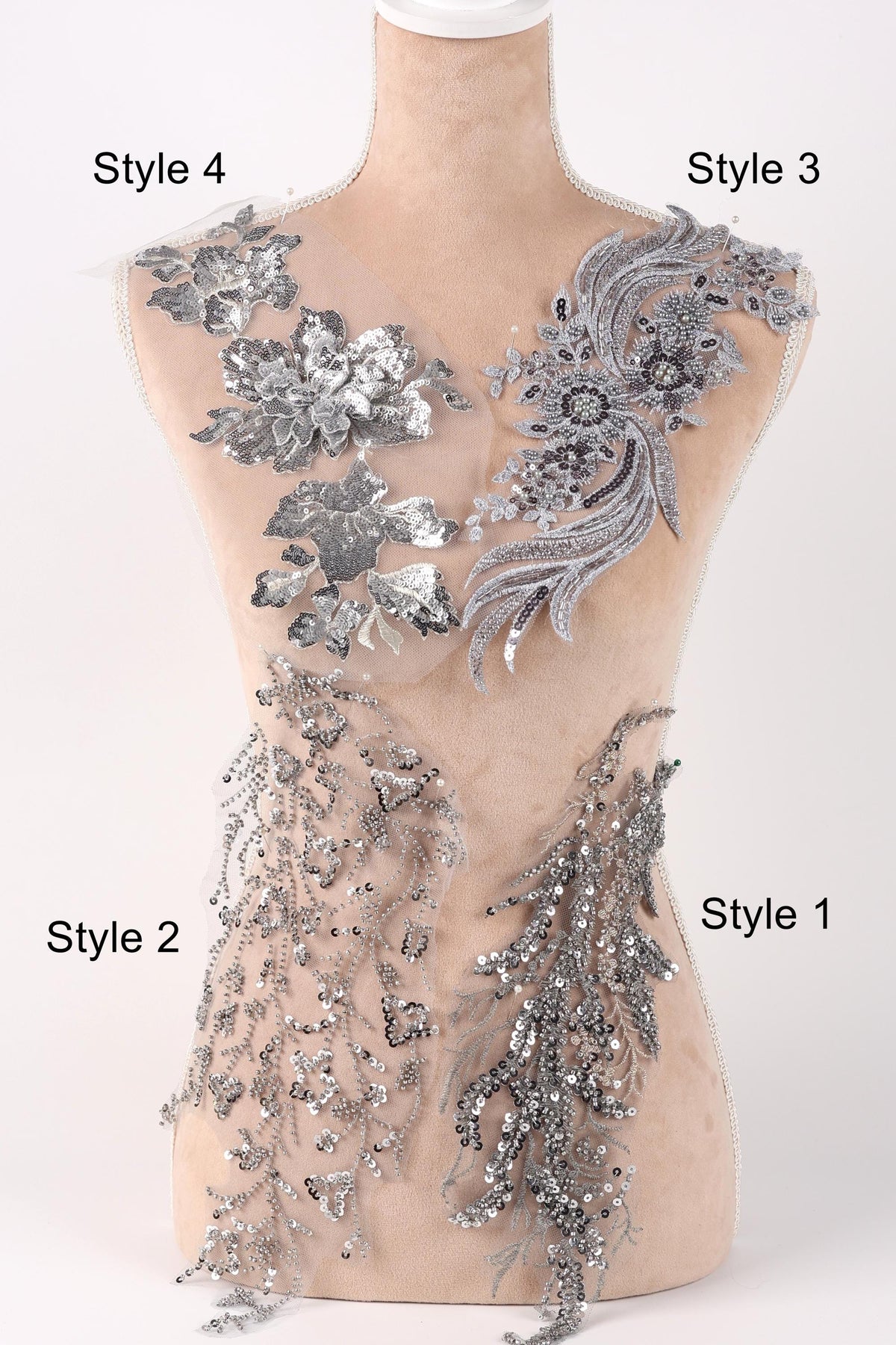 A mannequin with various silver and gray sequin embellishments on its bust and hips, displayed in different styles.