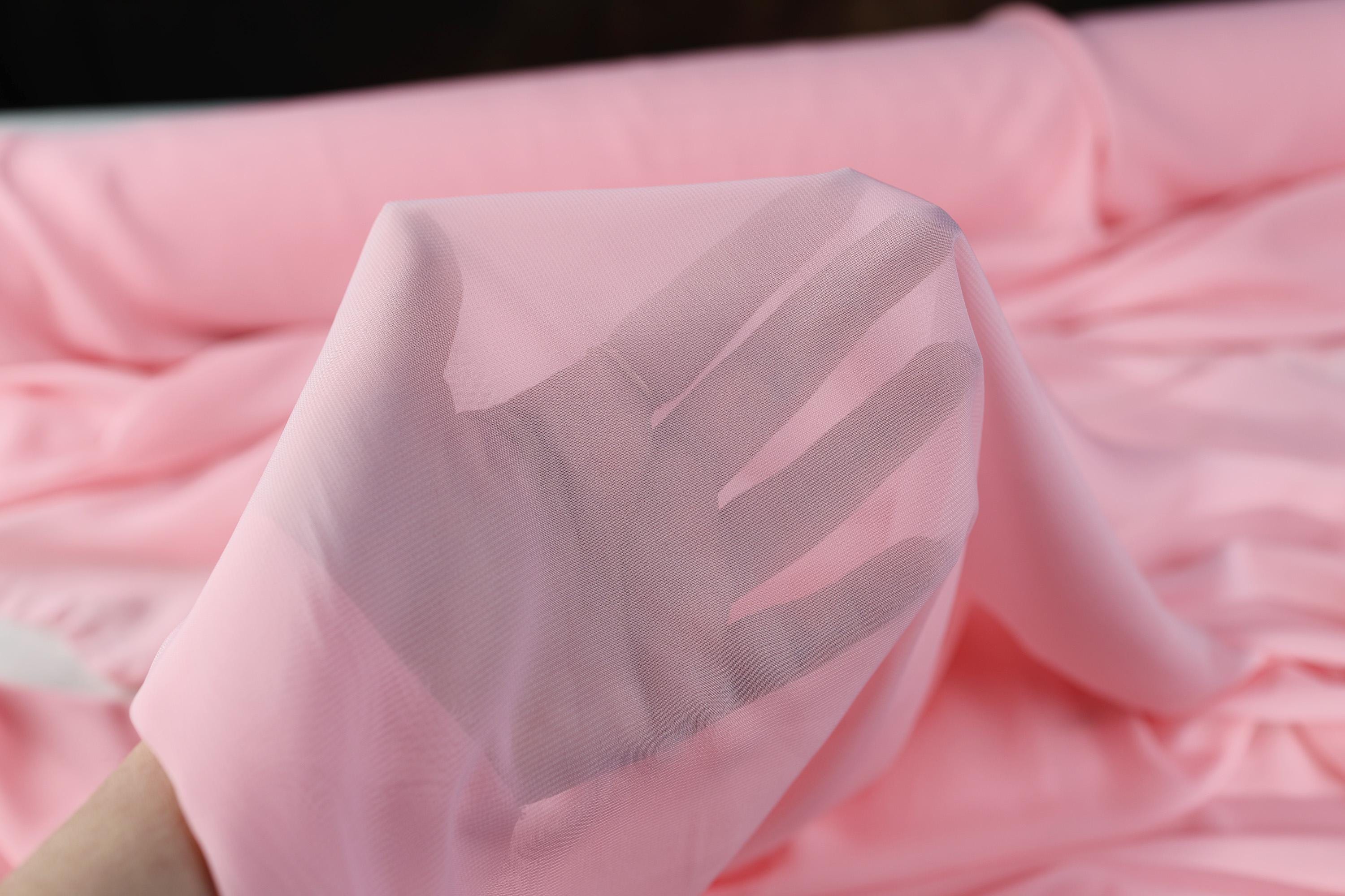 a person&#39;s hand is wrapped in a pink sheet