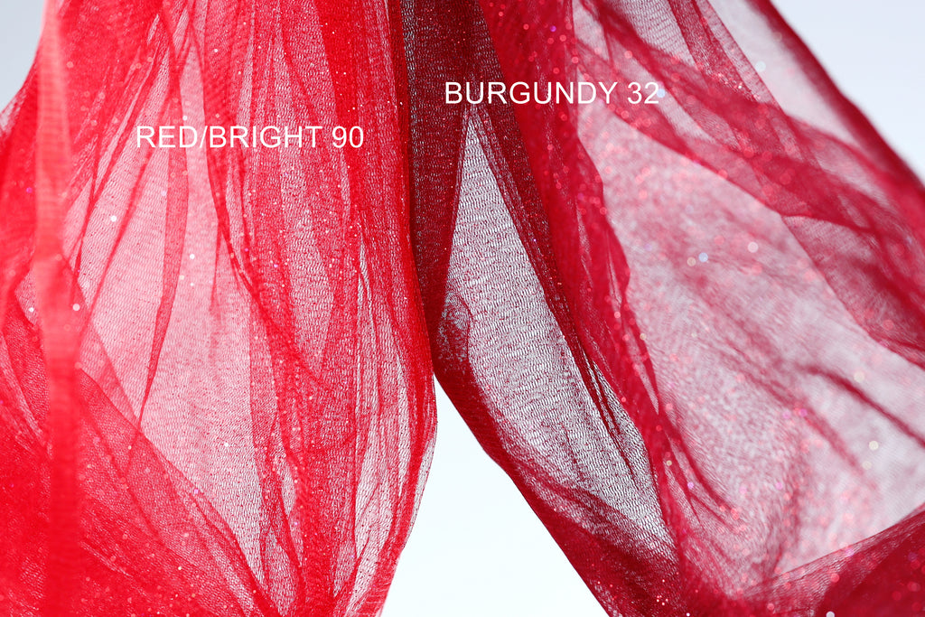 two pieces of red fabric, one appearing to be a bright red color and the other a more muted red color, possibly burgundy. The bright red fabric is labeled "REDBRIGHT 90" and the more muted red fabric is labeled "BURGUNDY 32".