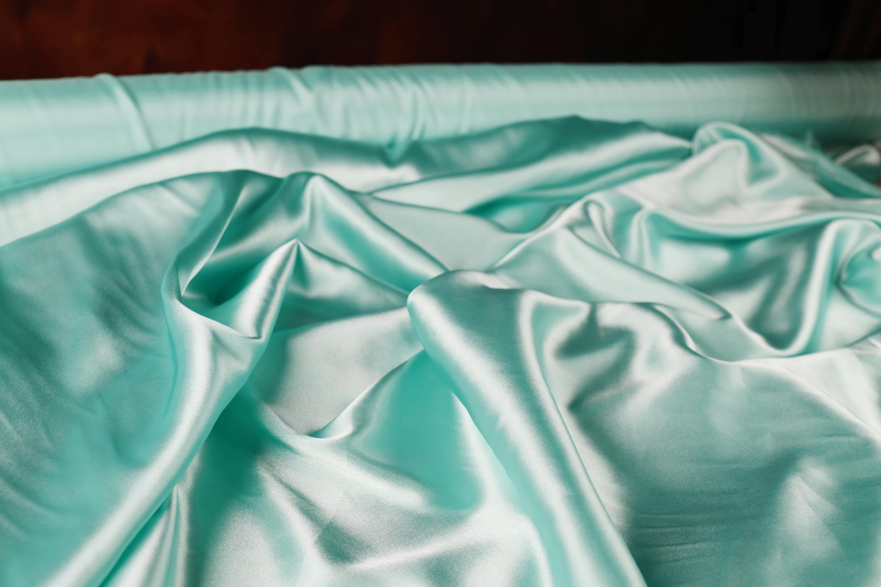 a close up of a sheet on a bed