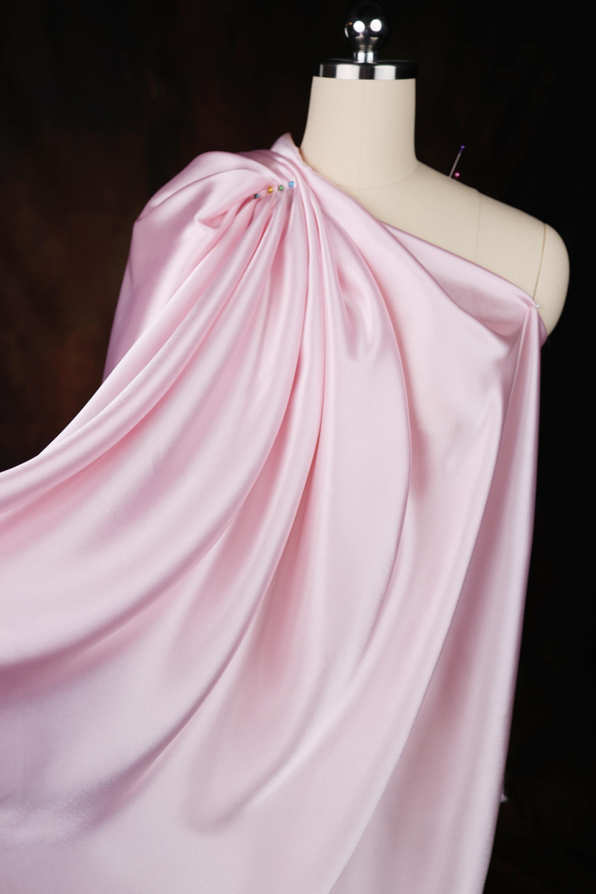 a mannequin with a pink dress on it
