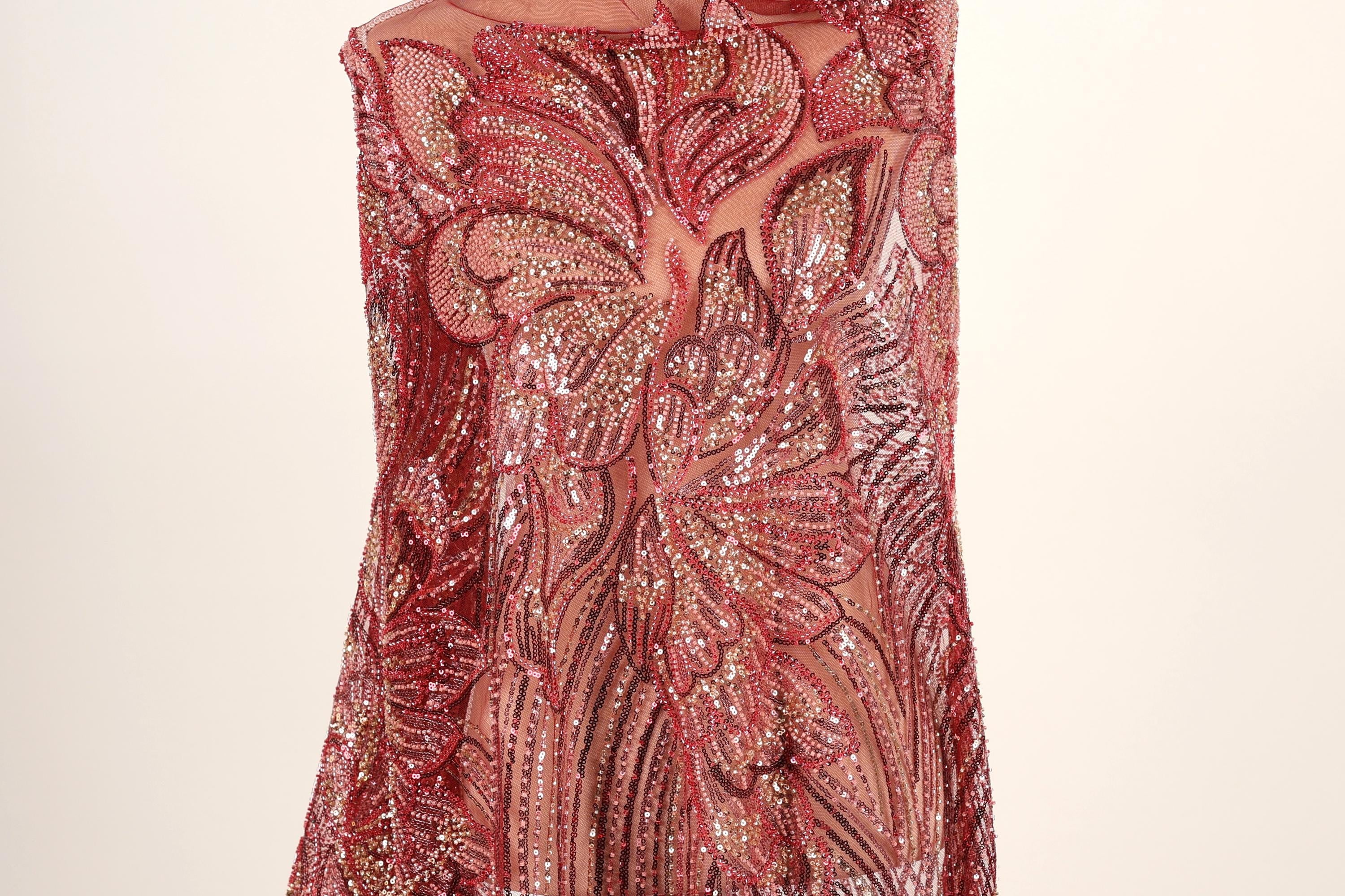 a dress with a red and gold sequined pattern.