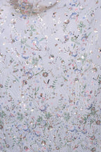 The image is a collage of various floral and leaf patterns in different colors, including shades of blue, green, pink, and white. The patterns are scattered across the image, creating a visually appealing and intricate design.