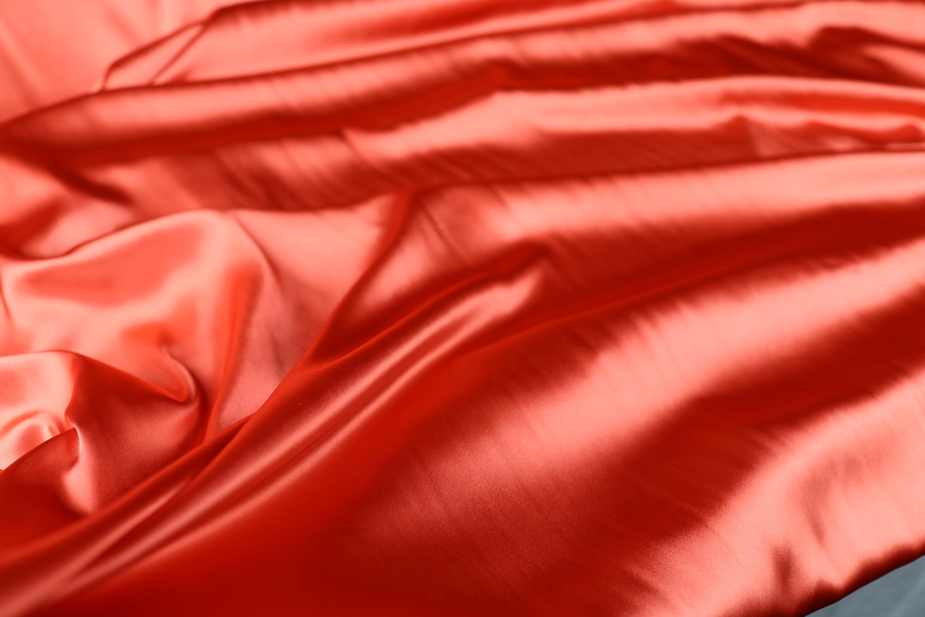 a close up of a red satin fabric