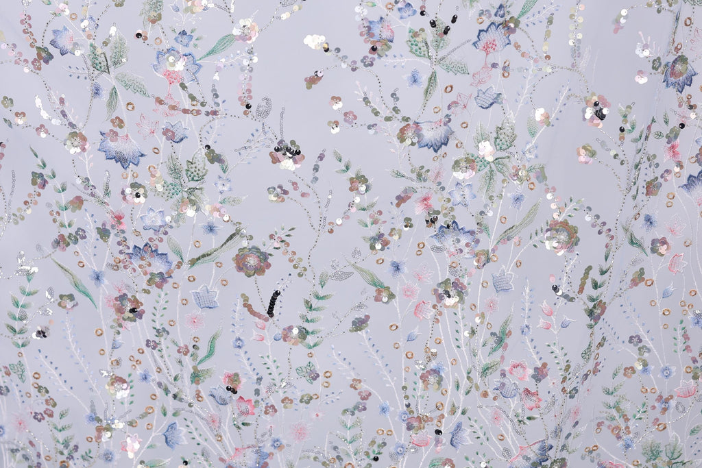 The image is a collage of various colorful floral and leaf patterns, creating a vibrant and visually appealing design.
