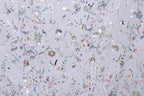 The image is a collage of various colorful floral and leaf patterns, creating a vibrant and visually appealing design.