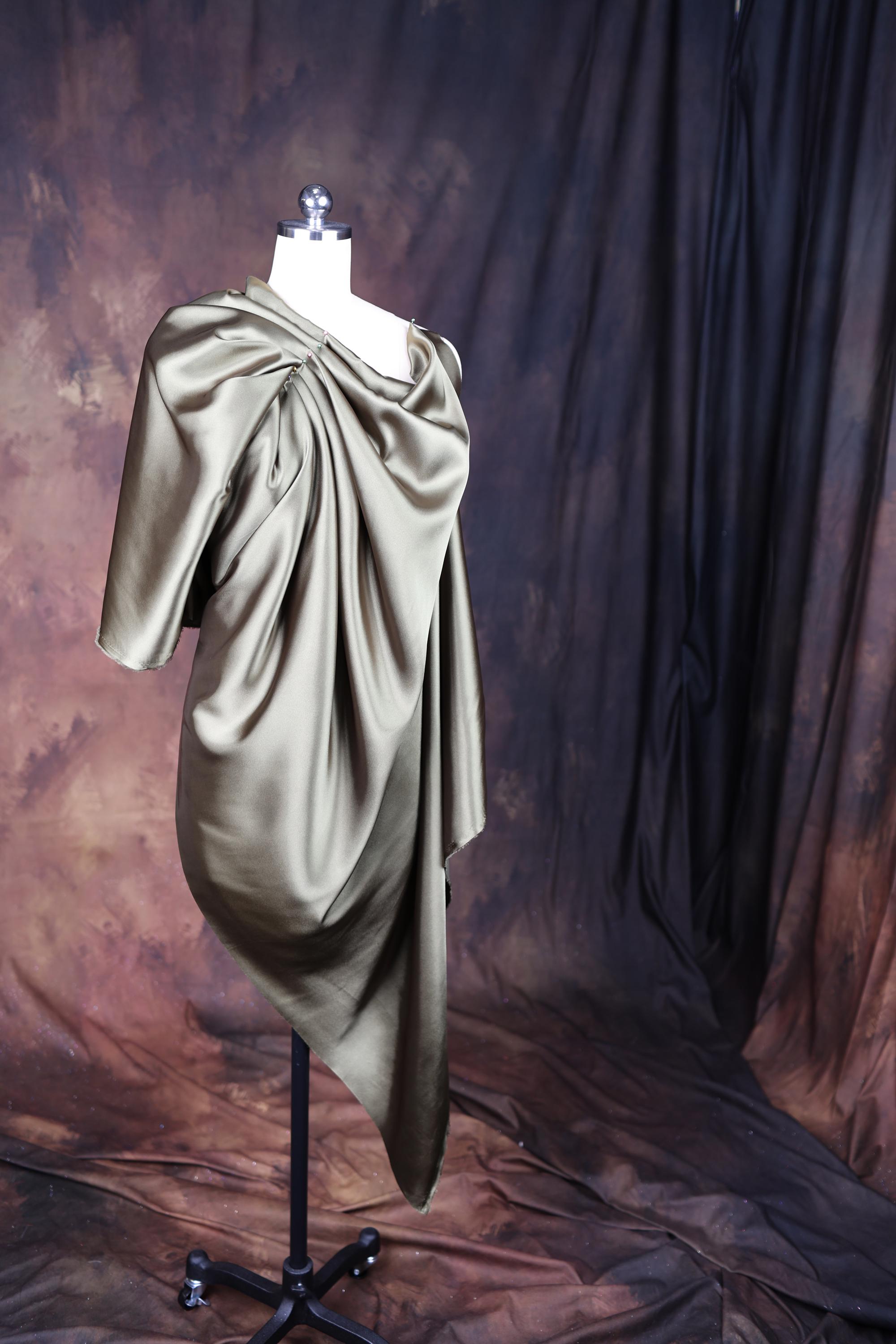 a mannequin with a dress on a stand