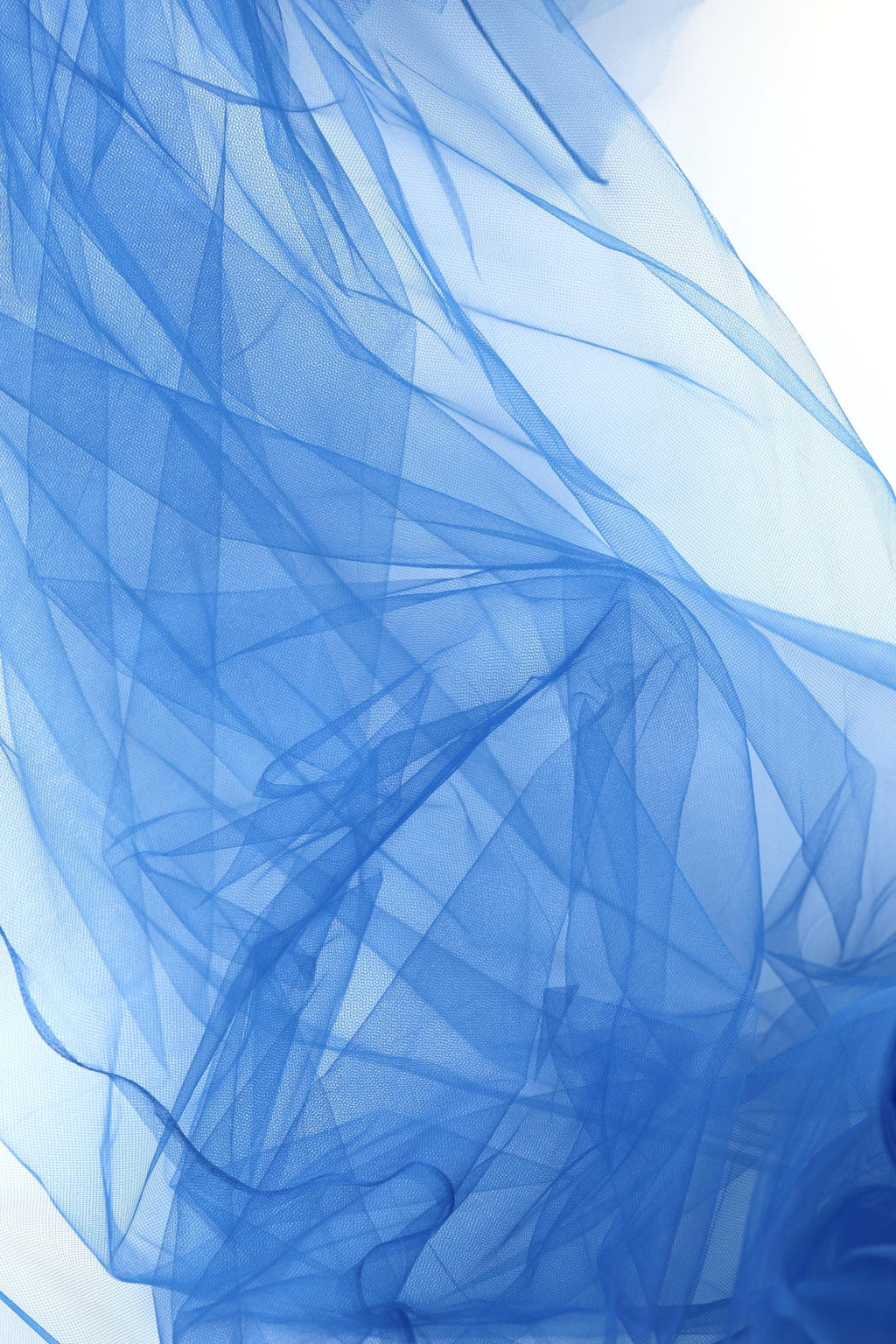 The image is a close-up view of a blue, flowing fabric, possibly a sheer or sheer-like material, with a textured and wrinkled appearance.
