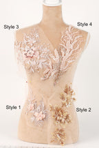 A mannequin with various decorative elements on its bust, including floral and leaf-like patterns in shades of pink and beige.