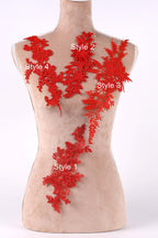 A mannequin with red floral embroidery on its bust area, each style labeled with a number.