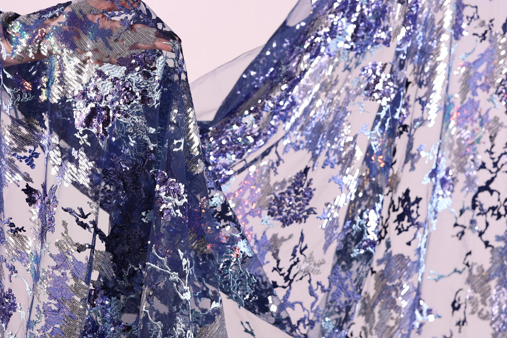 a close-up view of a fabric with a floral pattern, showcasing the intricate details and textures of the material.