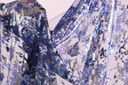 a close-up view of a fabric with a floral pattern, showcasing the intricate details and textures of the material.