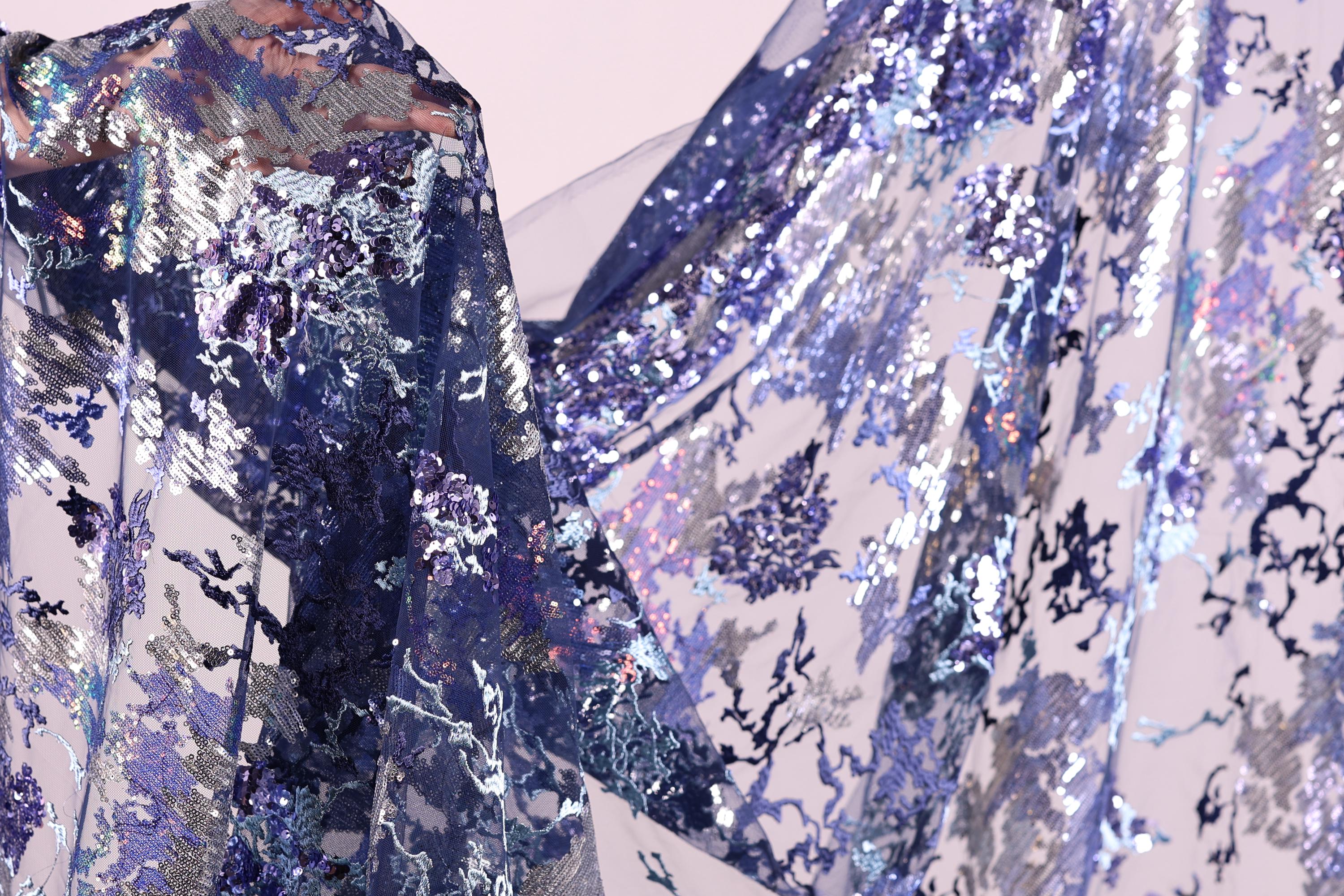 a close-up view of a fabric with a floral pattern, showcasing the intricate details and textures of the material.