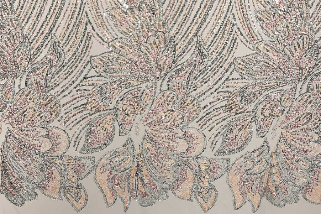 a close-up view of a fabric with a repeating pattern of pink and white flowers, as well as a repeating pattern of black and white lines. The flowers appear to be made of sequins, adding a touch of sparkle to the design. The pattern repeats across the entire fabric, creating a visually striking and intricate design.
