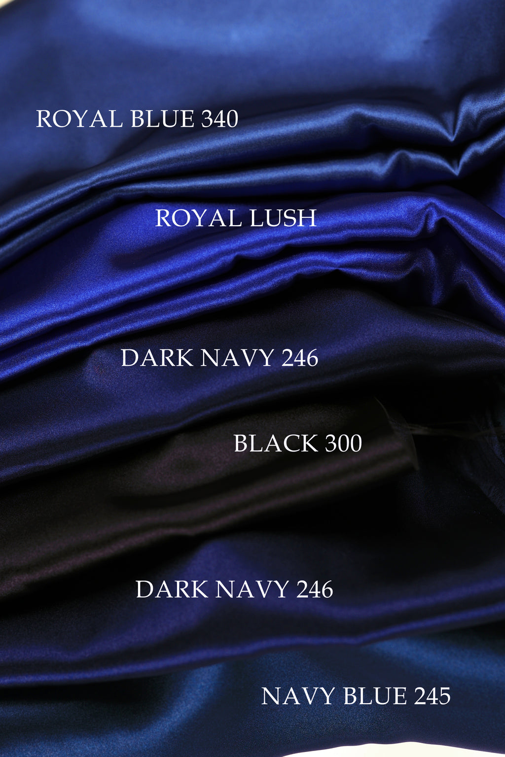 The image is a close-up of a pile of blue satin fabric, with each color labeled.
