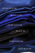 The image is a close-up of a pile of blue satin fabric, with each color labeled.