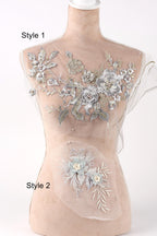 A mannequin with a floral embroidered design on its bust, featuring various styles of floral patterns and designs.