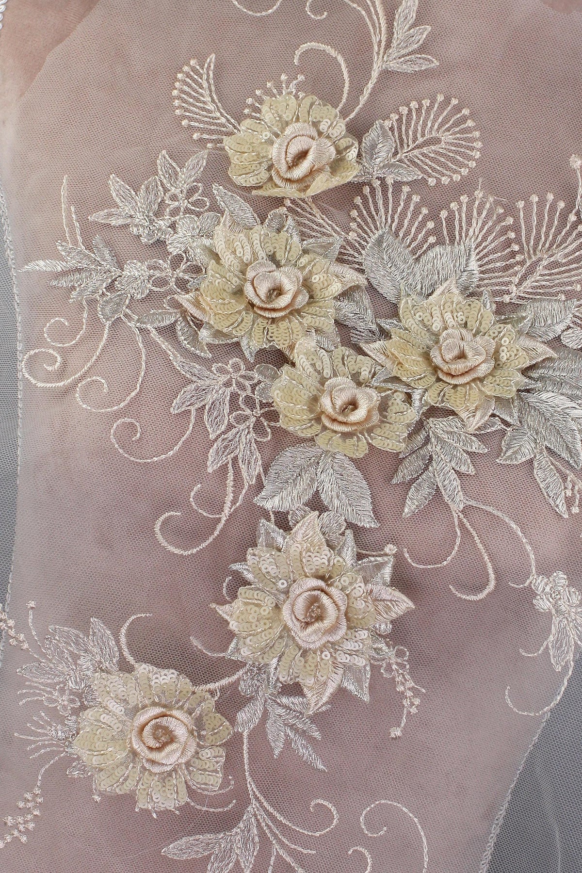 a close up of a dress with flowers on it