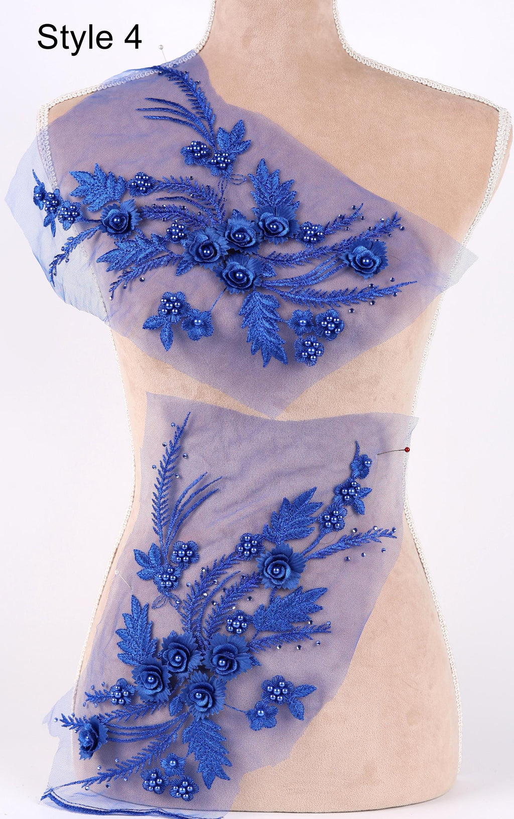 a mannequin with a decorative blue floral embroidery on its bust area.
