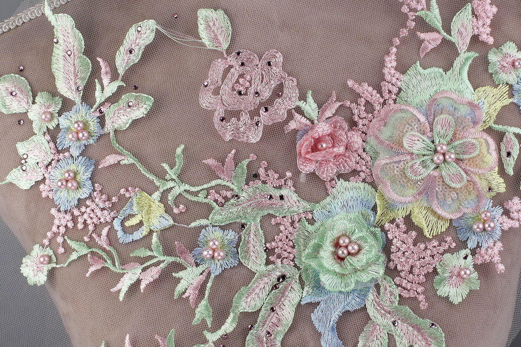 a close up of a dress with flowers on it