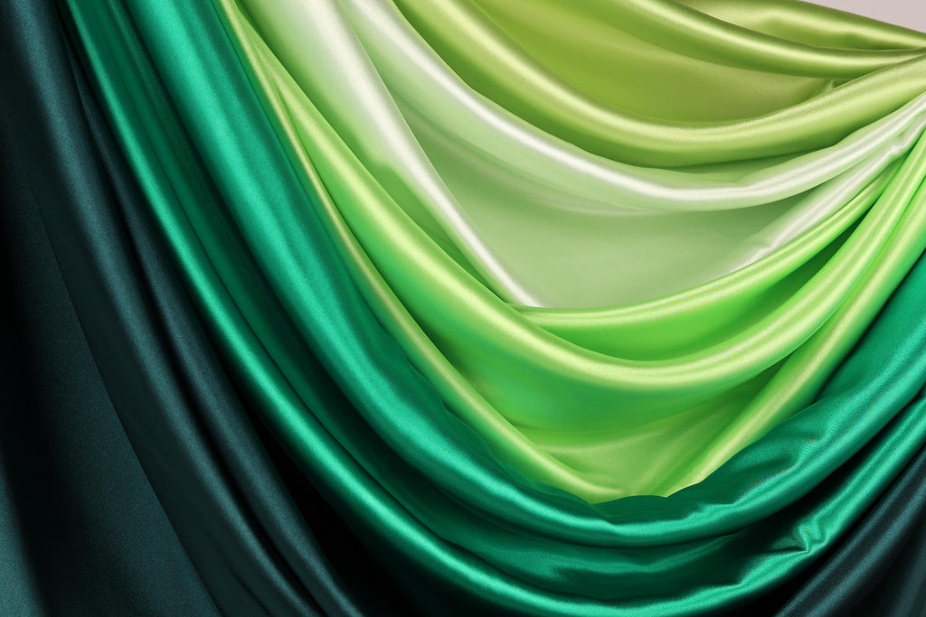 a close-up view of a fabric with a gradient of green and black colors, creating a visually striking and vibrant appearance.