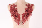 A mannequin torso with red sequin and floral embellishments on the bust area.