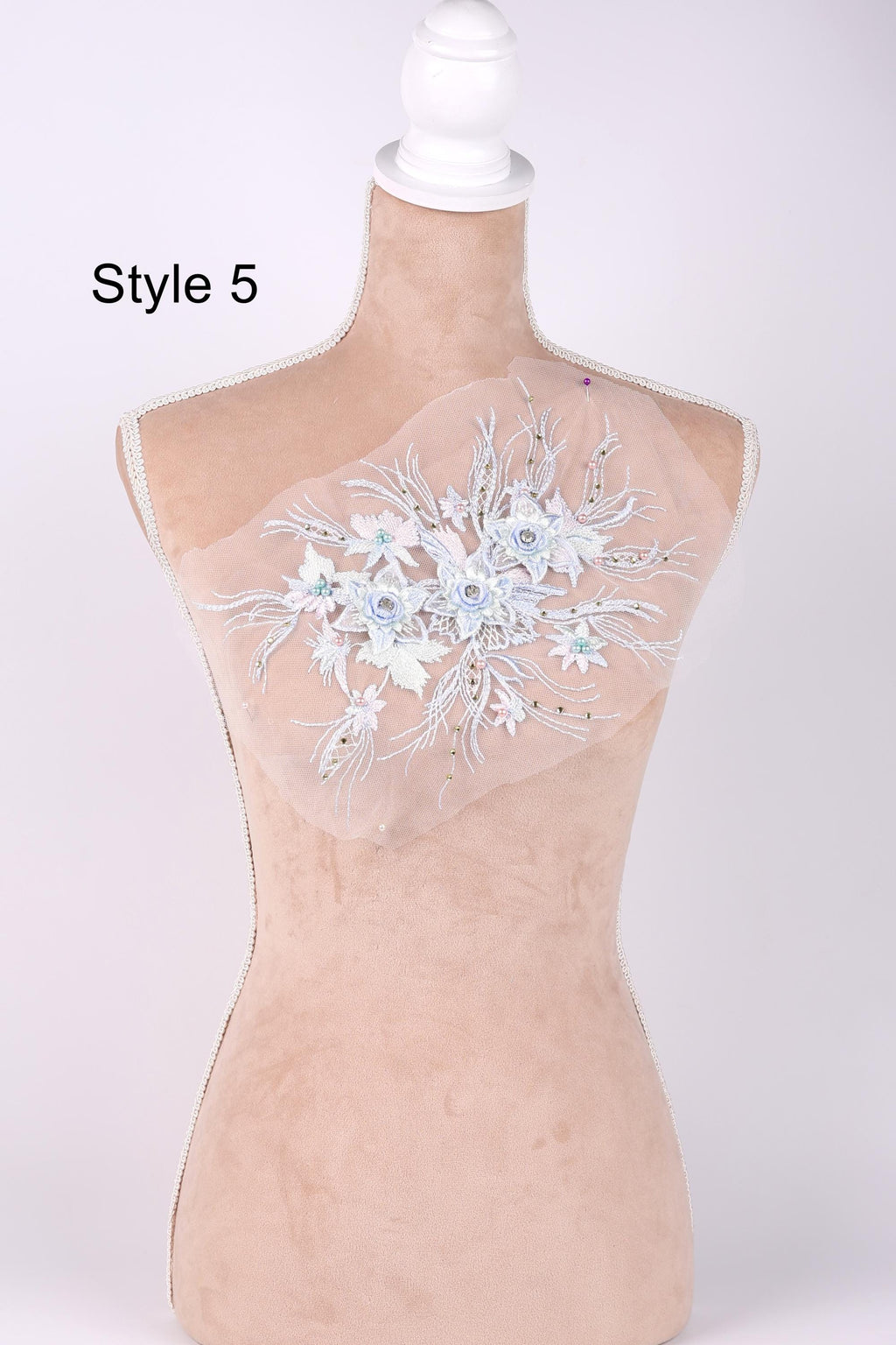 A mannequin with a floral embroidered patch on its bust, labeled as "Style 5".
