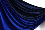 a close-up view of a shiny, blue fabric with a smooth, flowing texture. The fabric appears to be made of a shiny, satin-like material, giving it a luxurious and elegant appearance.
