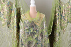 a mannequin wearing a green and silver sequined dress.