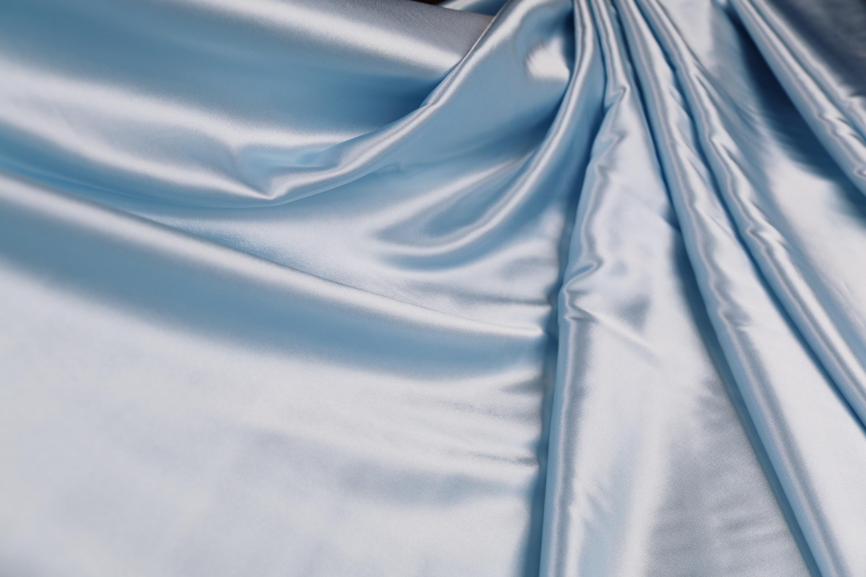 a close up of a shiny blue fabric