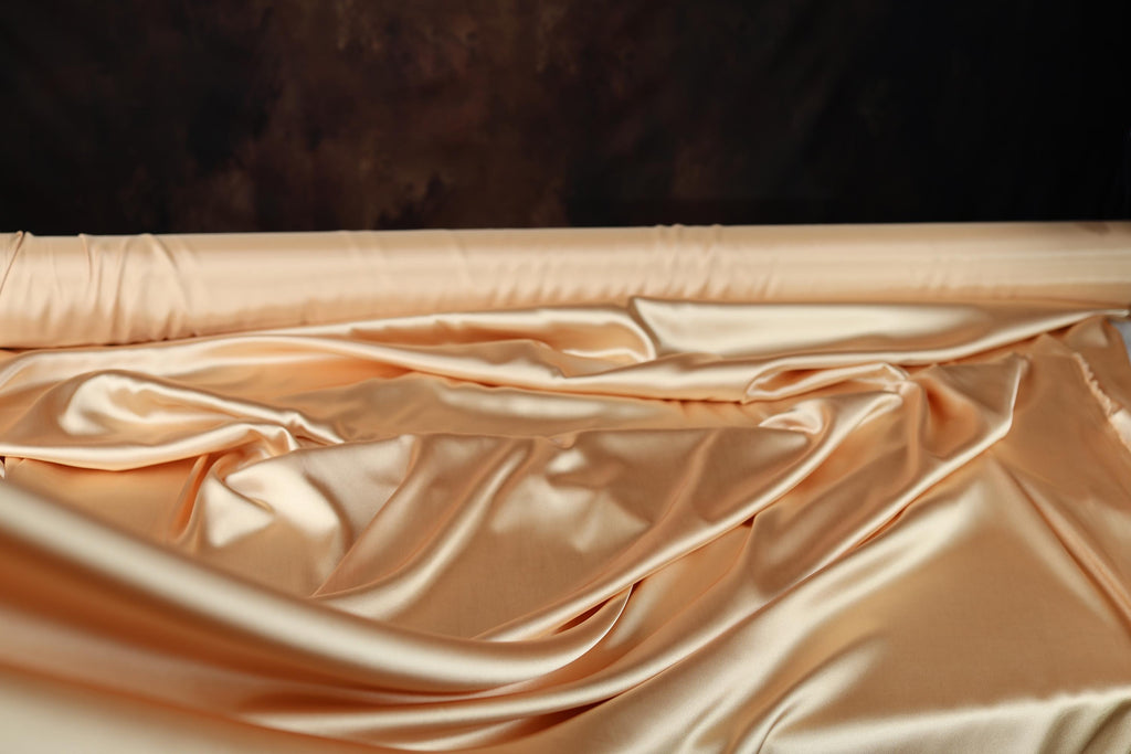 a baby crib with a sheet on top of it