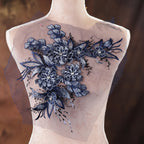 a mannequin with blue flowers on it's back