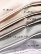 a collection of fabric swatches in various shades of gray, ranging from light to dark gray. The swatches are arranged in a gradient, with the light gray at the top, followed by the darker gray, and then the silver gray at the bottom. Each swatch has a label indicating the color, such as "TAUPE 400", "TAUPE 17", "TAN 2035", "PLATINUM GRAY 606", and "SILVER 100".