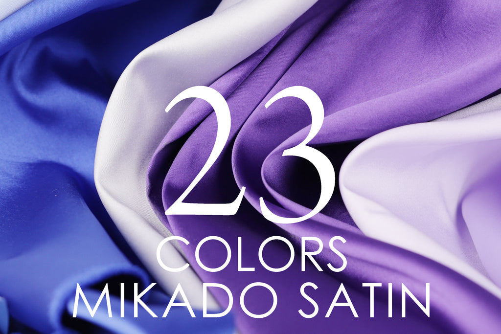 The image is a close-up of a fabric with the text "23 COLORS MIKADO SATIN" overlaid on it.