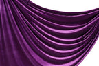 a close-up view of a shiny, purple satin fabric with a smooth, flowing texture.
