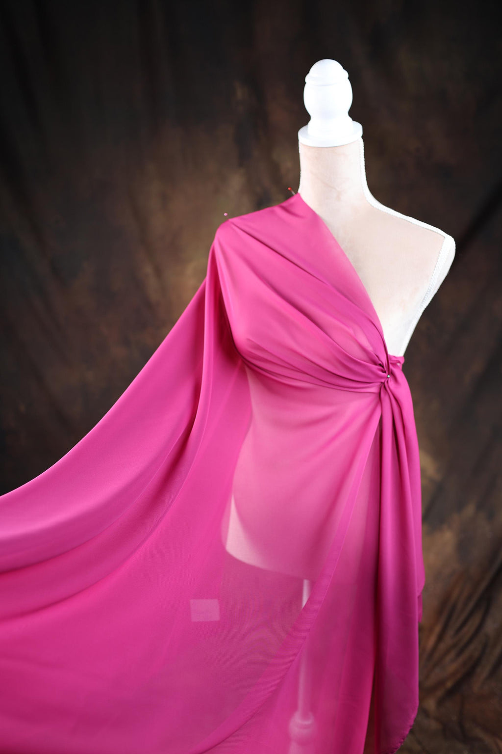 a mannequin with a pink dress on it