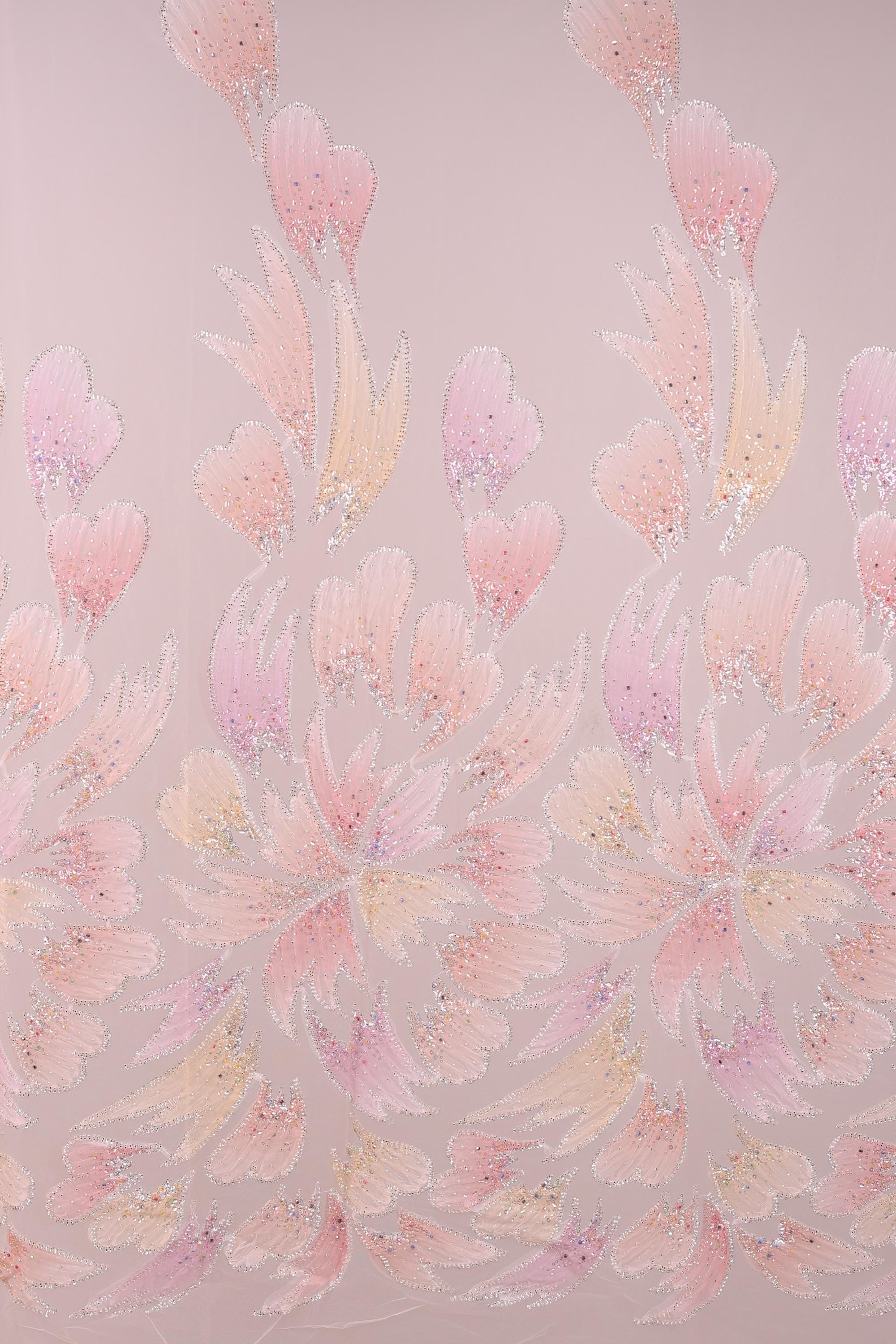 a repeating pattern of pink and yellow flowers or leaves against a pink background.