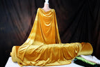 a mannequin dressed in a golden cloth