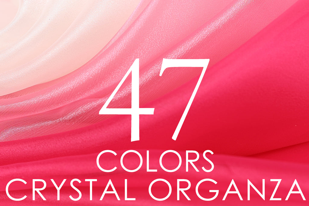 The image is a close-up of a fabric with the number "47" and the words "COLORS CRYSTAL ORGANZA" displayed prominently.