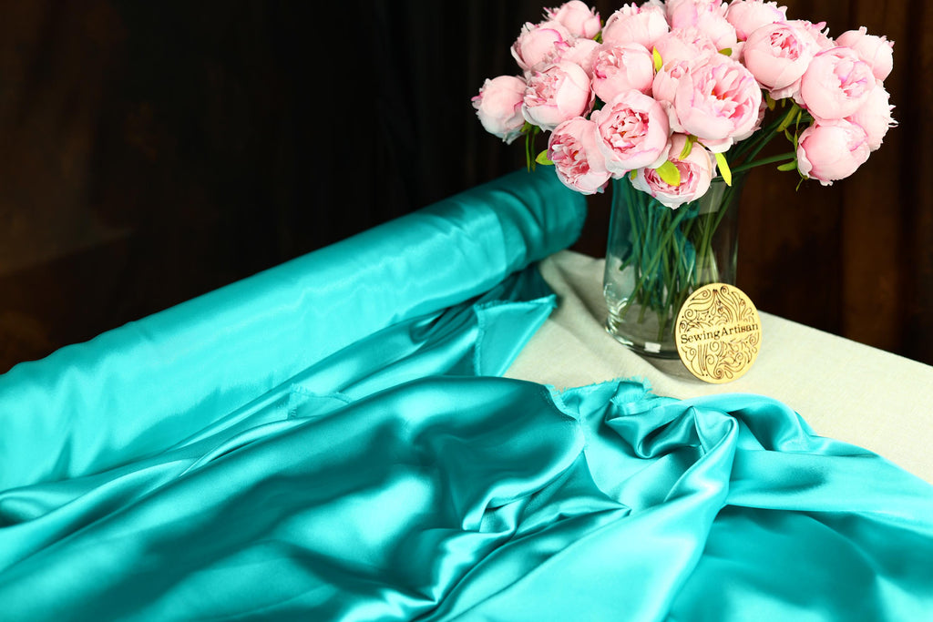 a vase filled with pink flowers on top of a table