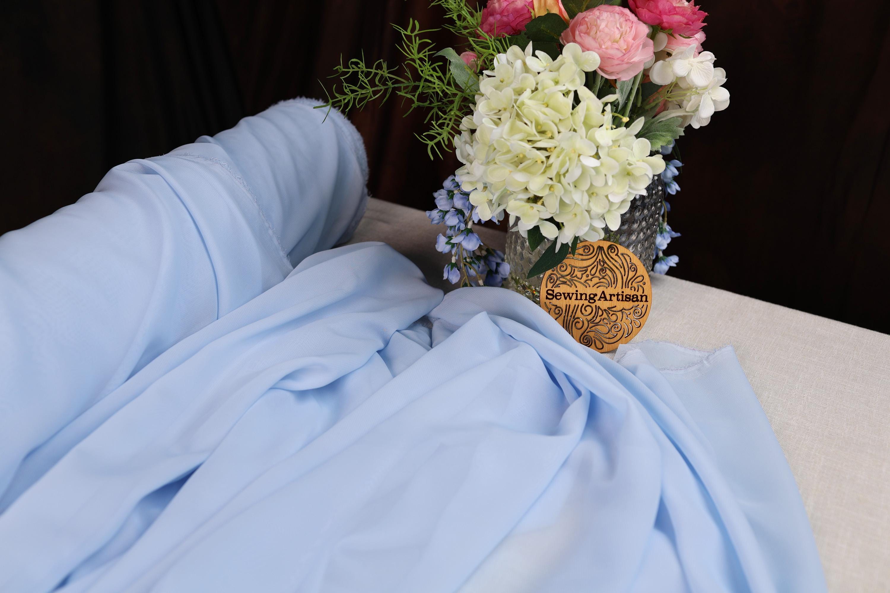 a bouquet of flowers in a vase on a bed
