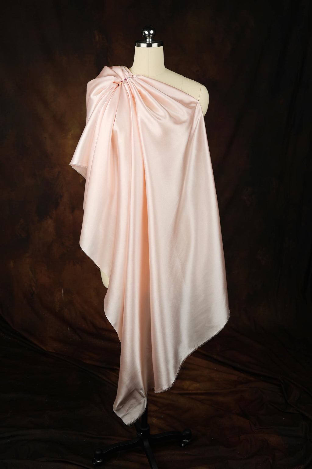 a dress on a mannequin on a black background