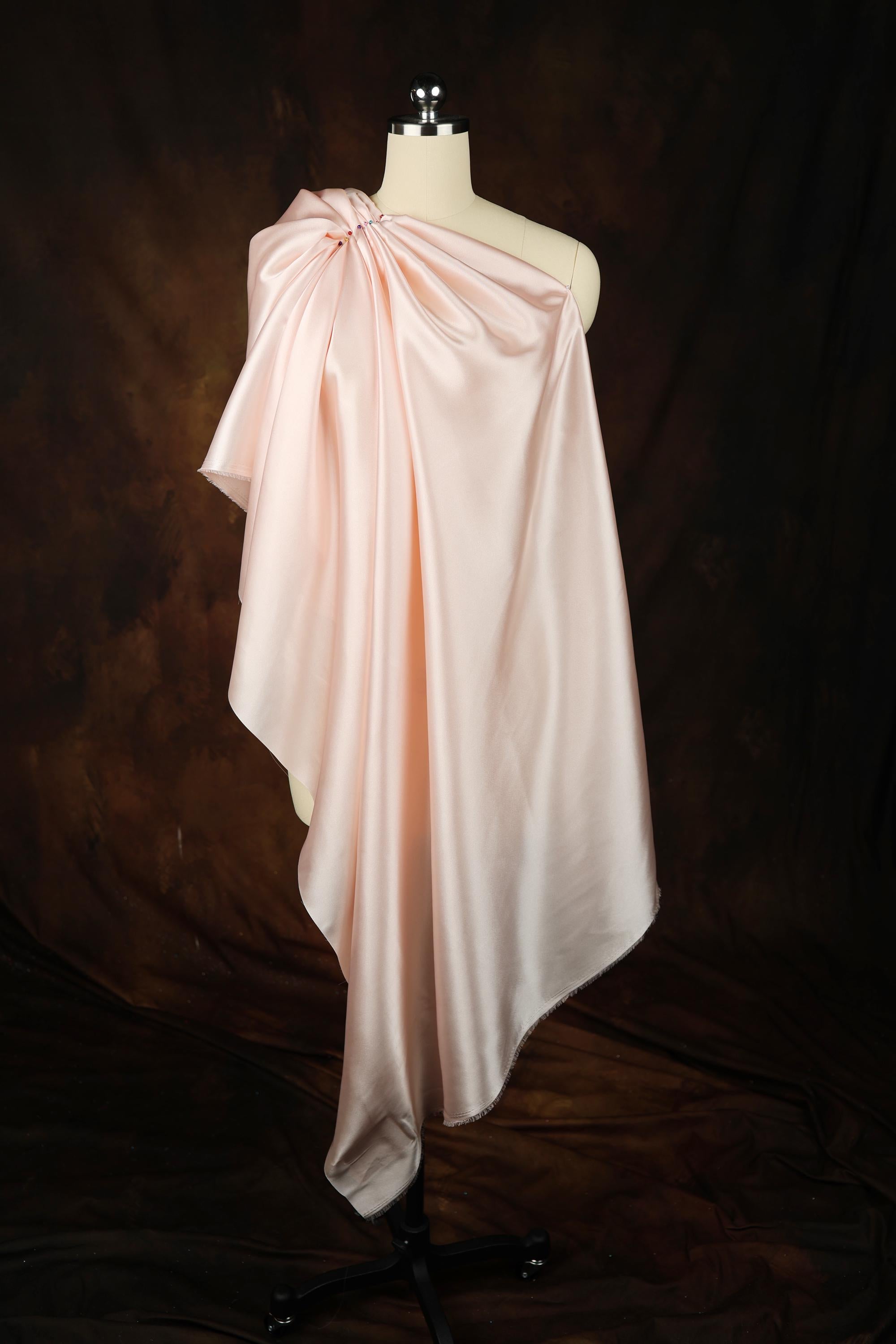 a dress on a mannequin on a black background