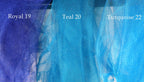 three different shades of blue fabric, each labeled with a number and a word. The first fabric is labeled "Royal 19", the second fabric is labeled "Tea 20", and the third fabric is labeled "Turquoise 22".