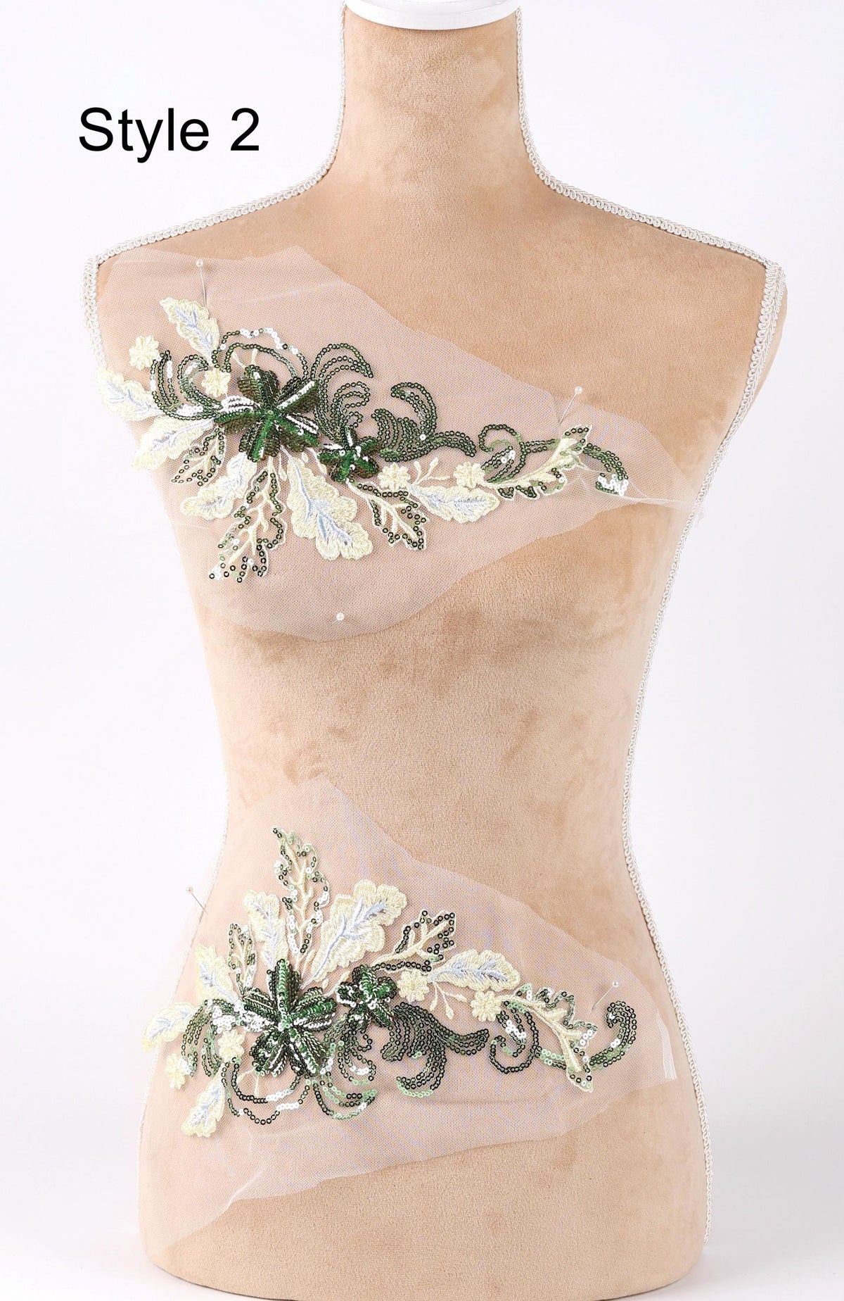 A mannequin with a beige body and a floral pattern on its torso.