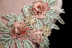 a close up of a dress with flowers on it