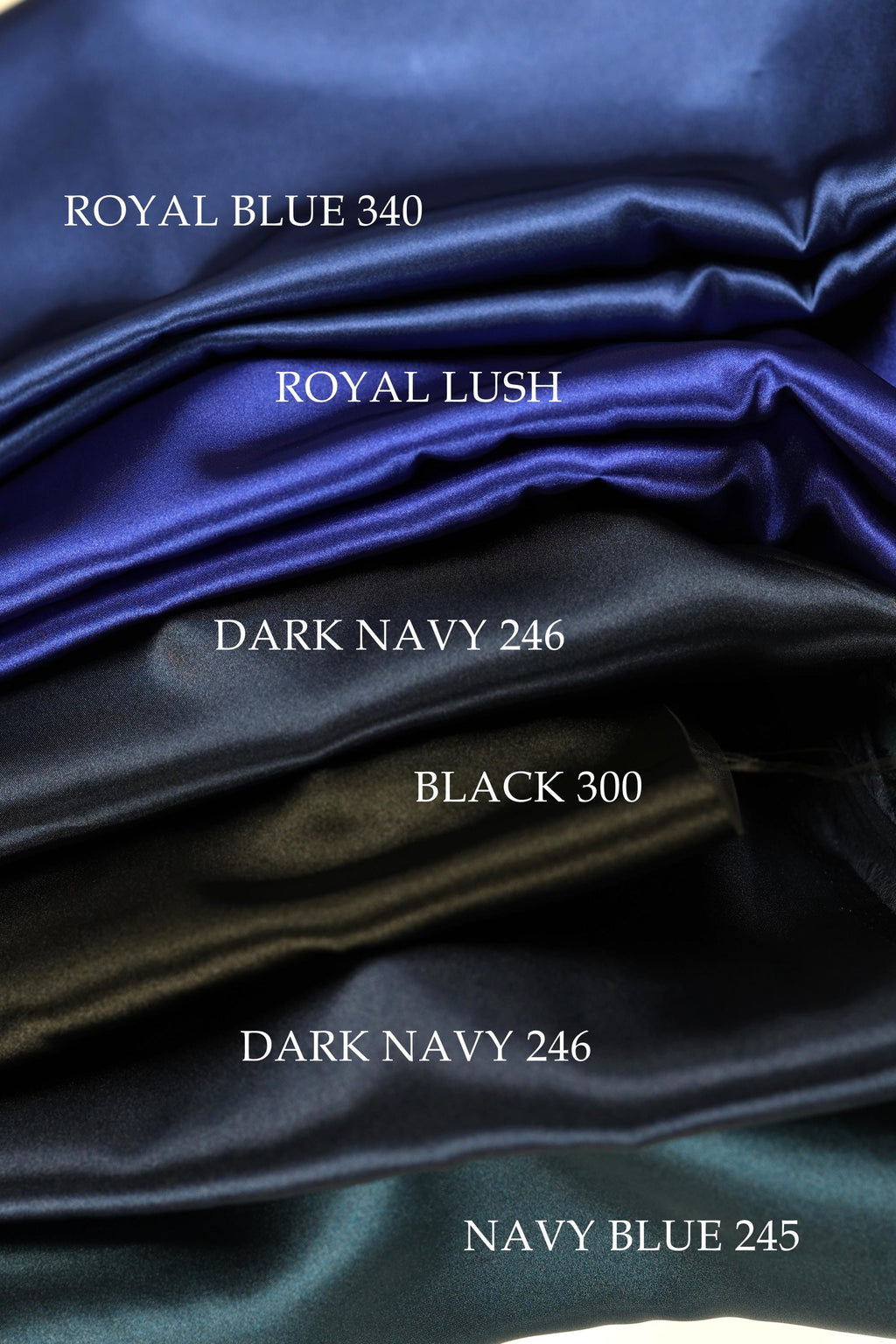 five different colored satin fabrics, each labeled with a color name: Royal Blue 340, Royal Lush, Dark Navy 246, Black 300, and Navy Blue 245.