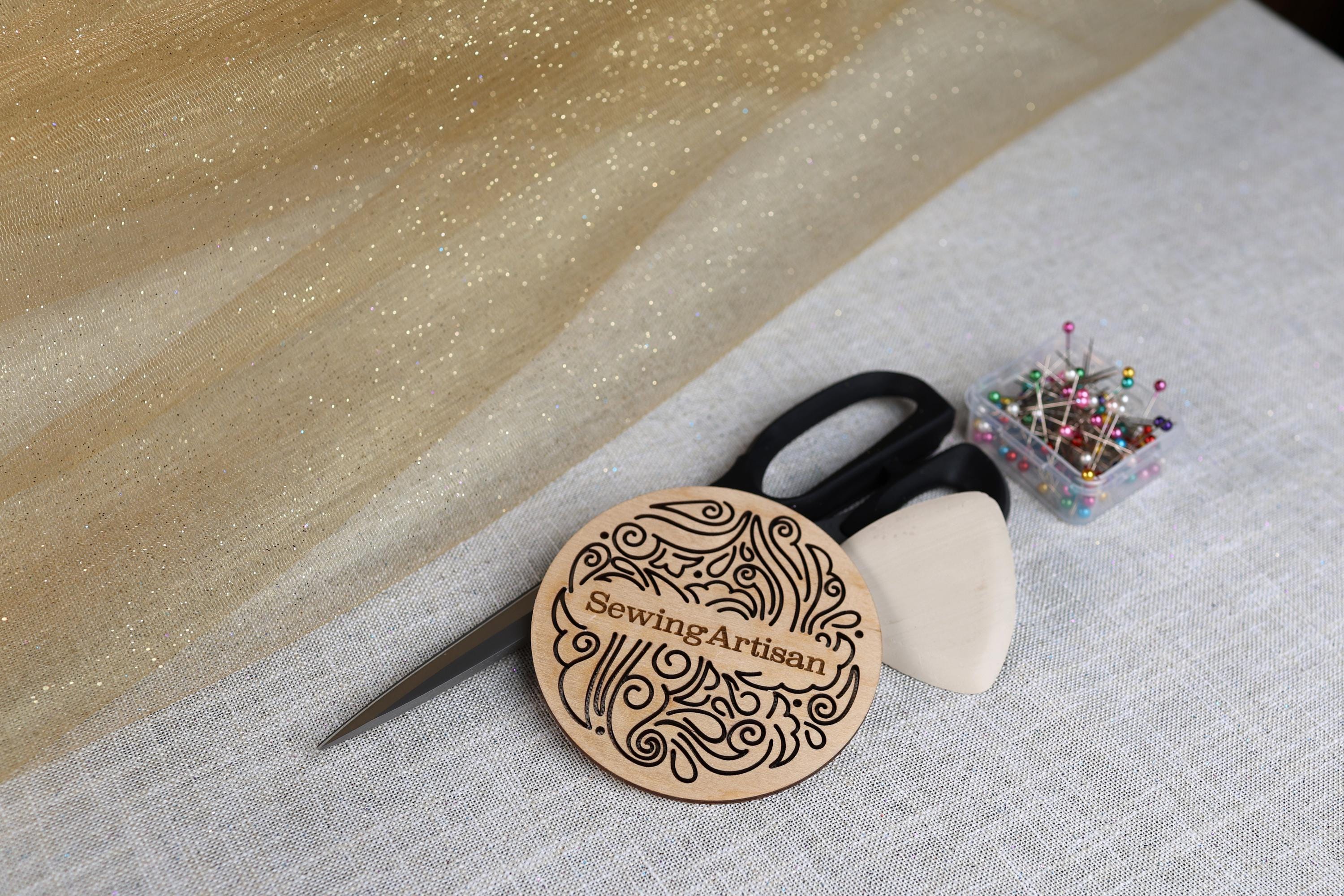 a pair of scissors sitting on top of a table